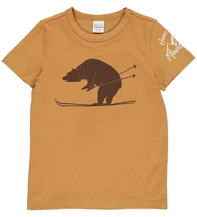 Light brown Fred's World t-shirt with brown skiing bear print on front and white text on sleeve