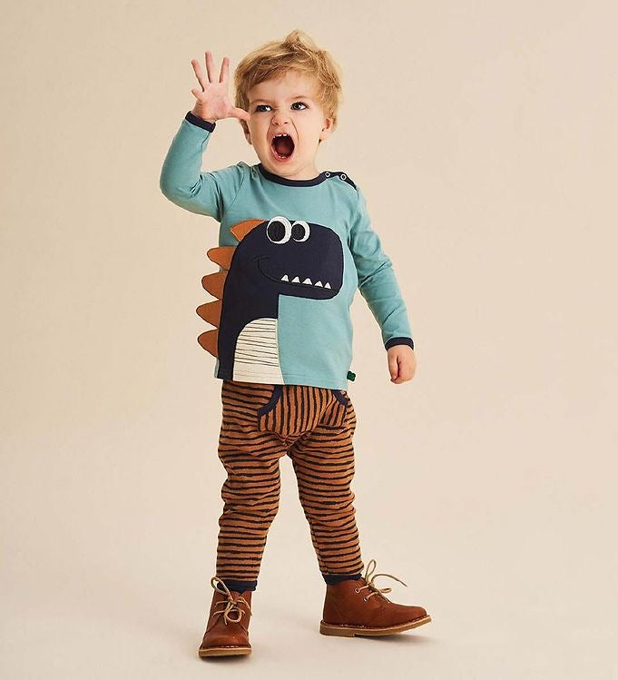 Fred's World mineral sweatshirt with navy dinosaur and brown spikes, snap shoulder closure