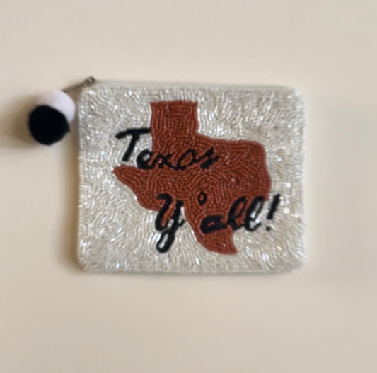 La Chic Texas Y'all beaded purse in white, brown, and black with pom-pom zipper closure