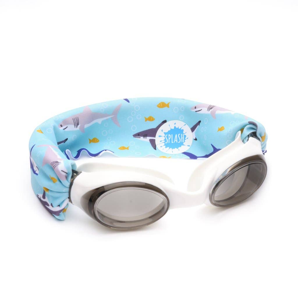 Shark Attack swim goggles by Splash with shark print strap, white frame, and grey-tinted lenses