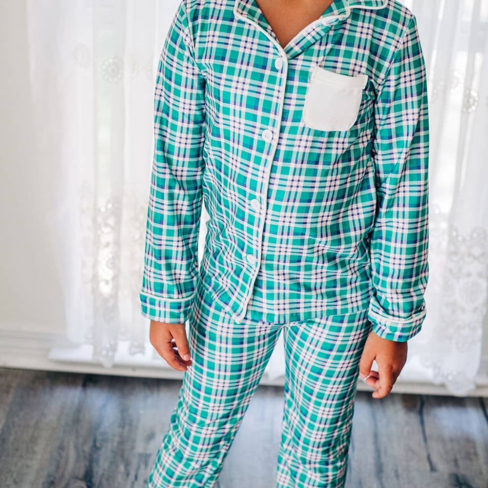 Green, purple, and white plaid button-down two-piece pajamas with white trim details