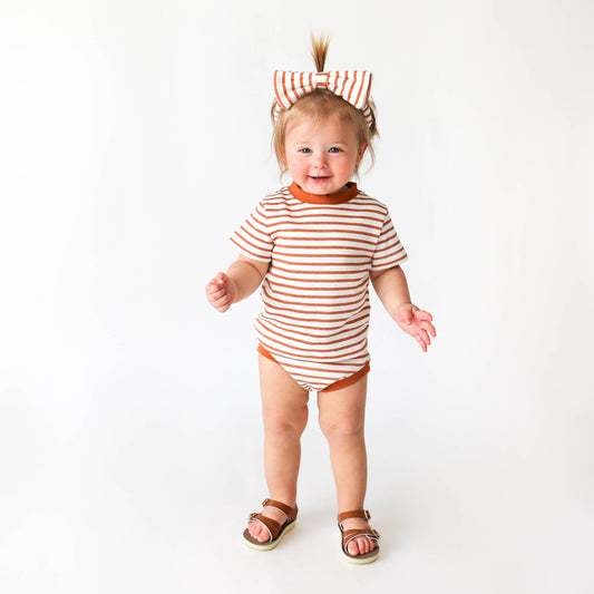 Terracotta striped baby t-shirt in organic cotton with contrast trim detail