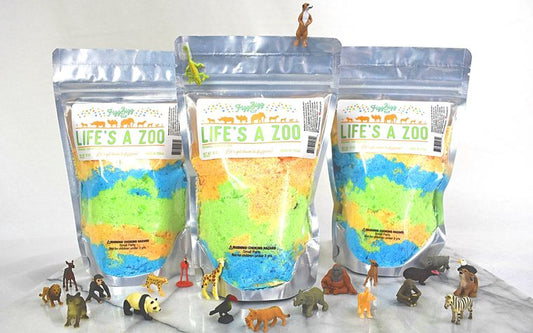 Life's A Zoo bath salts pouch with vibrant colors and trinkets inside